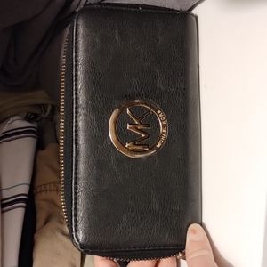 Michael Kors large pebbled wallet.